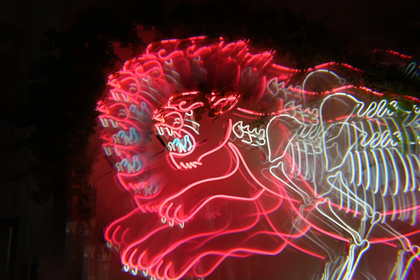 Red and white neon dinosaur sign hand-bent by Neon Flamingo in Los Angeles