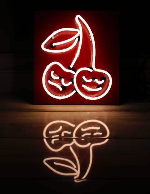 Happy Sad Cherry Logo mounted to a red painted square backing. 