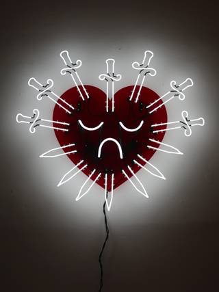 A neon sign featuring seven swords mounted to a transparent red acrylic piece cut in the shape of a heart.